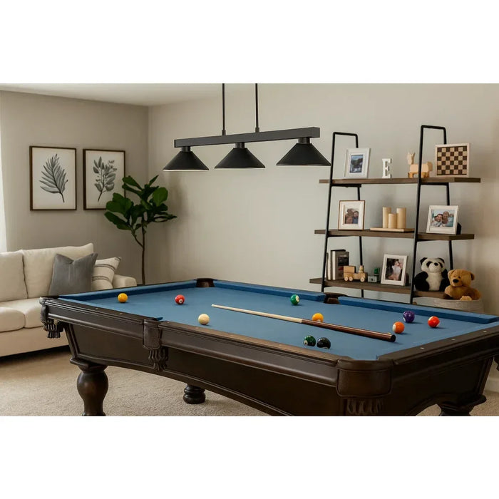 Z-Lite Cobalt Matte Black 3-Light Billiard Pendant over a blue felt pool table in modern game room – sleek matte black finish with adjustable rods